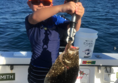kid_with_flounder