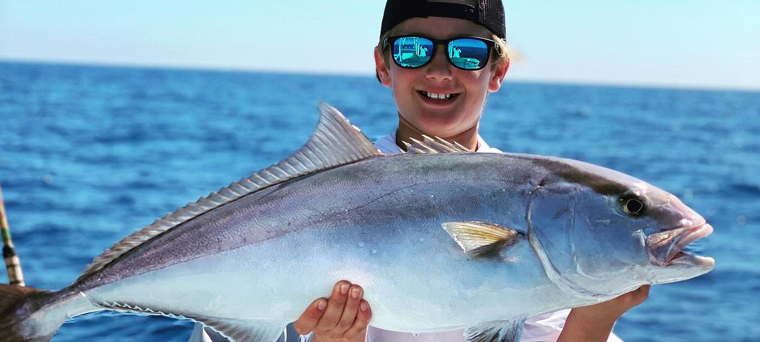 These kids are stoked to be fishing offshore on a charter.