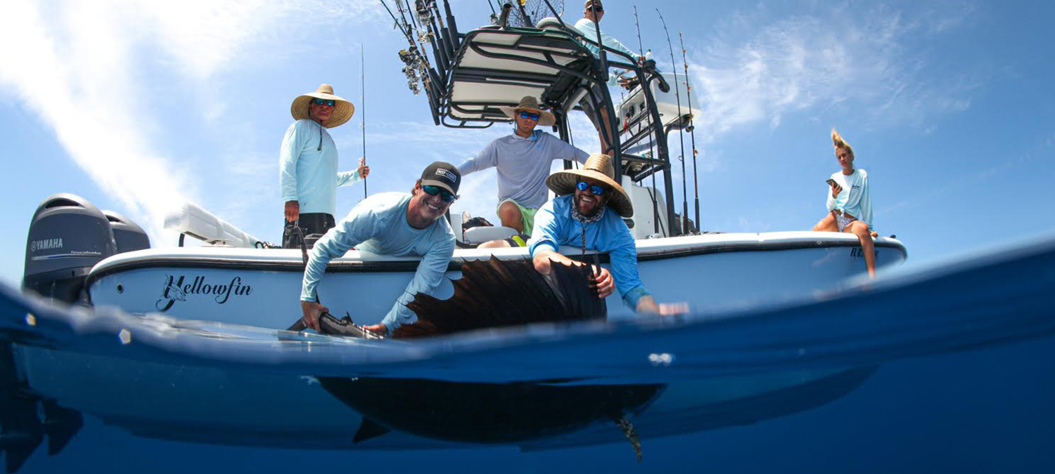 Great shot of the 26' Yellowfin in action as well pull up some blackfin tunas on an offshore fishing charter. 